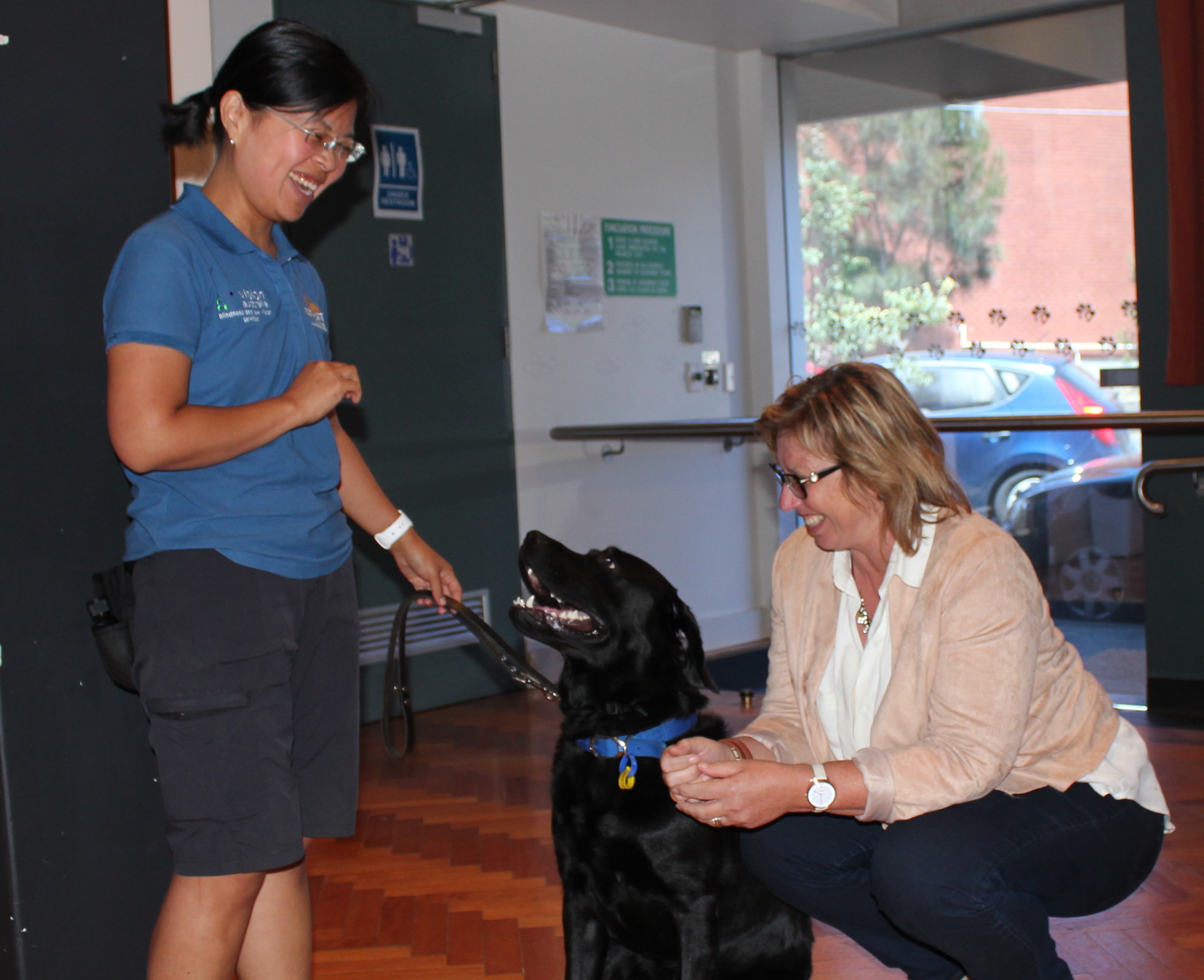 Rosie meeting black Seeing Eye Dog Luke; named after her son.