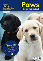 PAWS for a moment cover showing brown and white labrador puppies
